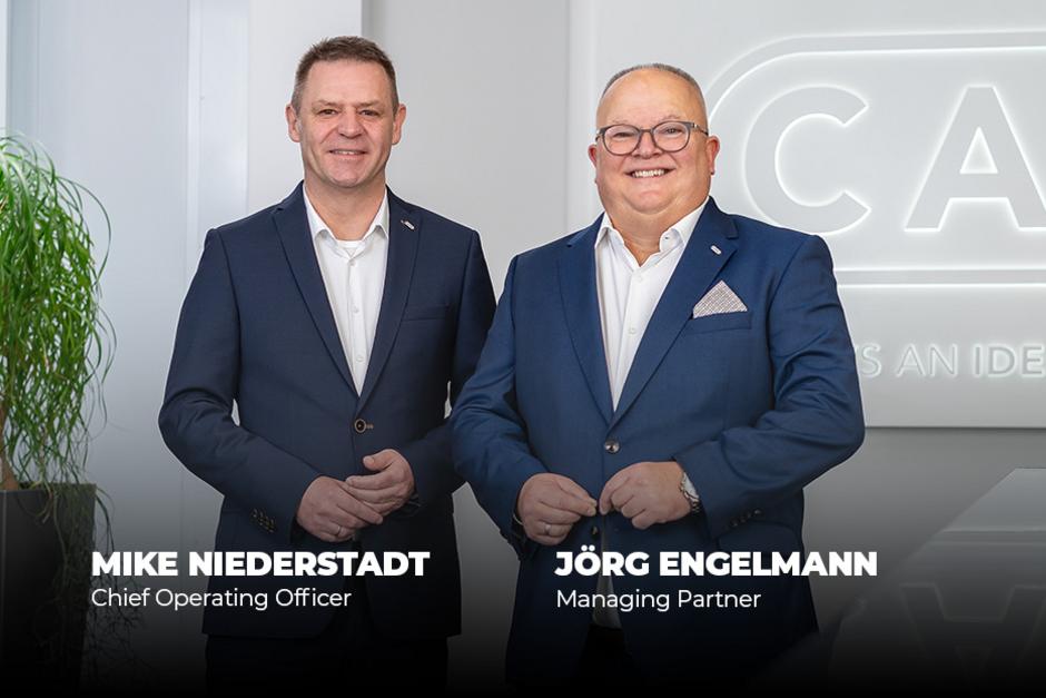 CEOS posing together in front of a neutral background